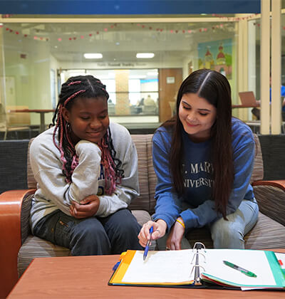 Dede Fioklou-Toulan and Belyn Thompson have their monthly meeting at the Greehey School of Business.